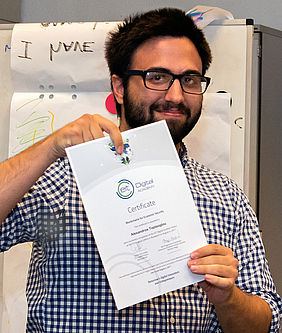 Alexandros Toptsoglou receiving his Summer School certificate (Digital Finance - Economics of Blockchain Security in Budapest).